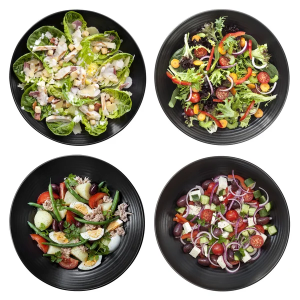 Набор различных салатов на белом фоне — стоковое фото