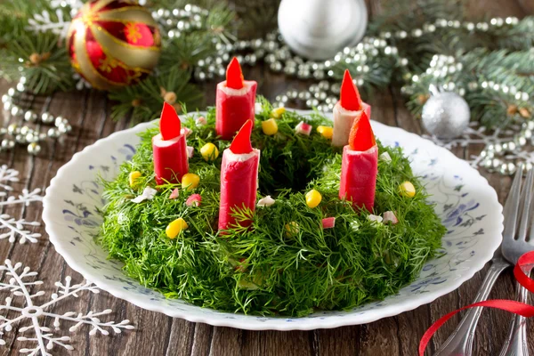 Christmas salad with rice, corn, cucumber and crab sticks. Decor — стоковое фото