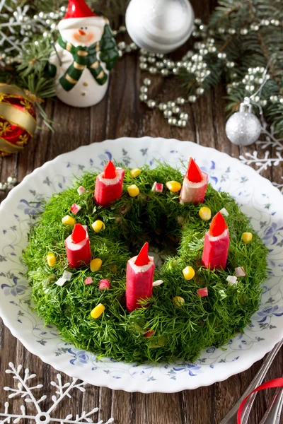 Christmas salad with rice, corn, cucumber and crab sticks. Decor — стоковое фото